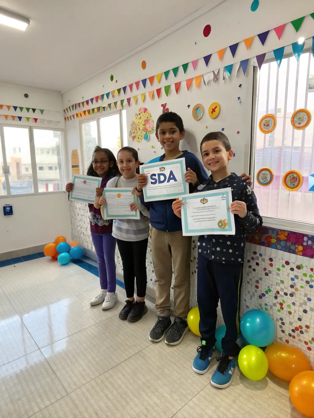 A diverse group of ProgramLearnUK students celebrating the completion of a software development project, highlighting the school's inclusive environment.